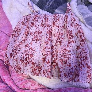 White floral shirt with red flowers